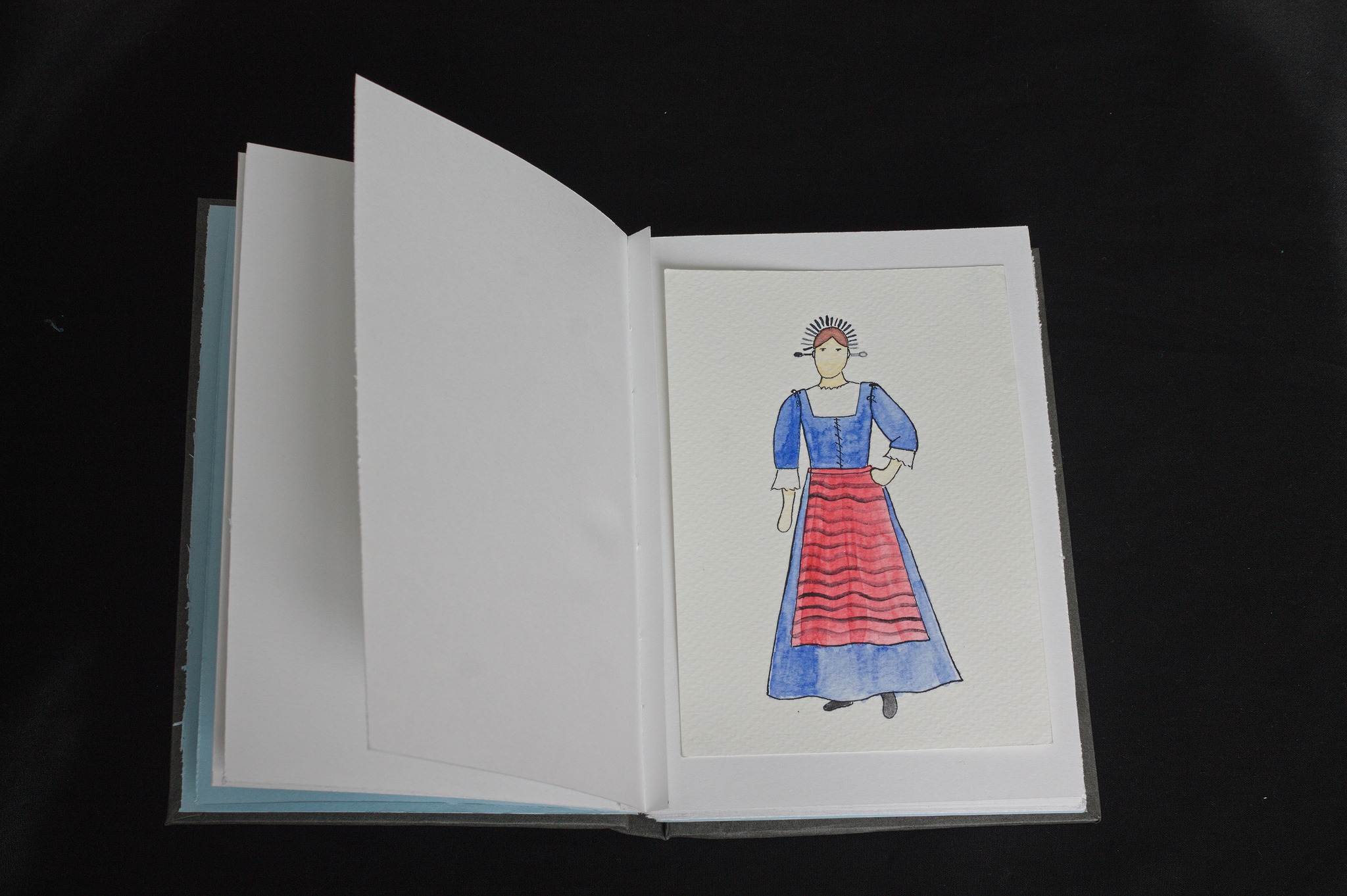 an open book with a watercolour of a costume pasted from two corners on one page; near the spine there is a sliver of paper as a spacer.