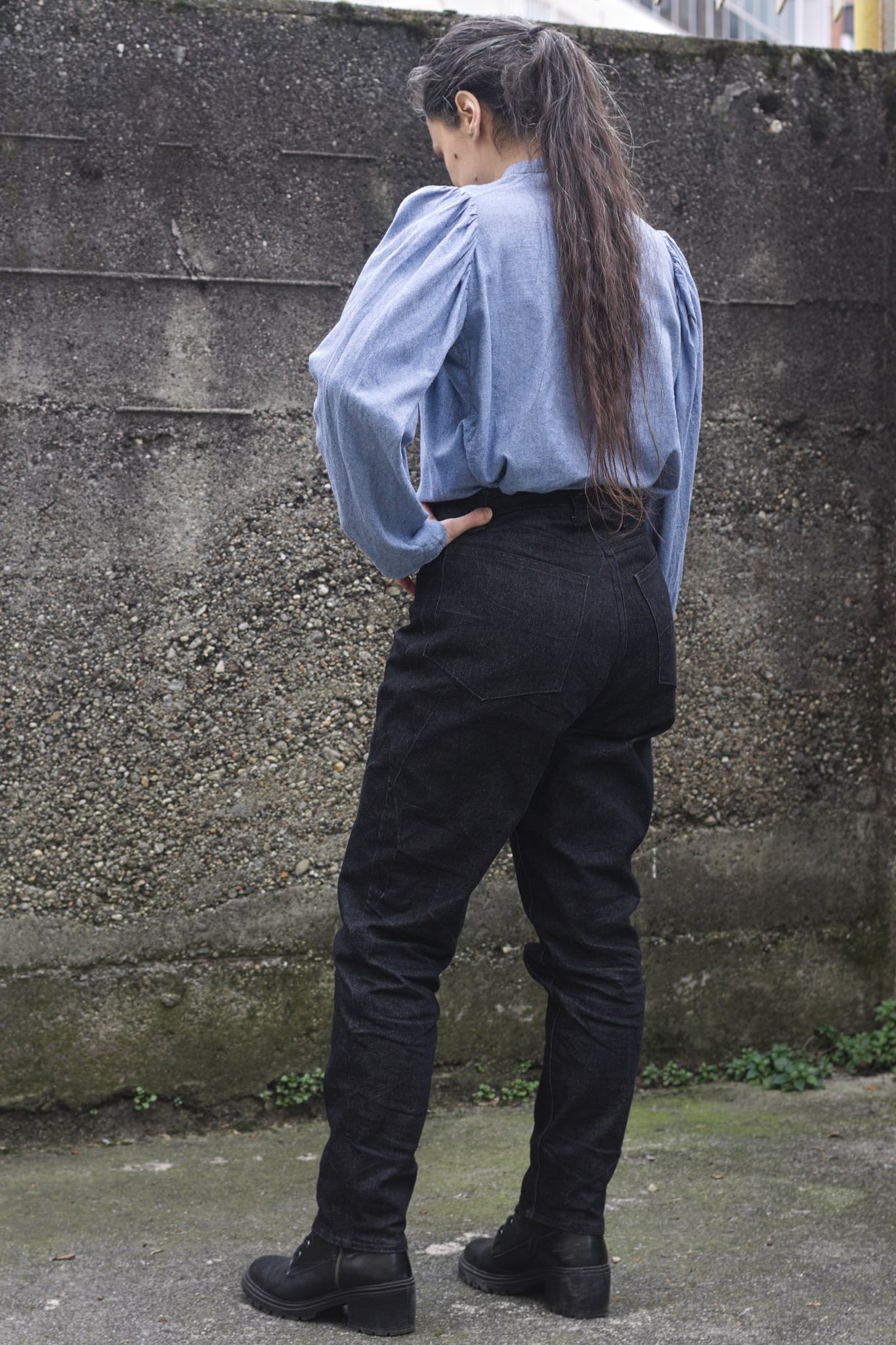 A woman wearing another pair of jeans; the waistband here is shaped to fit rather than having elastic.