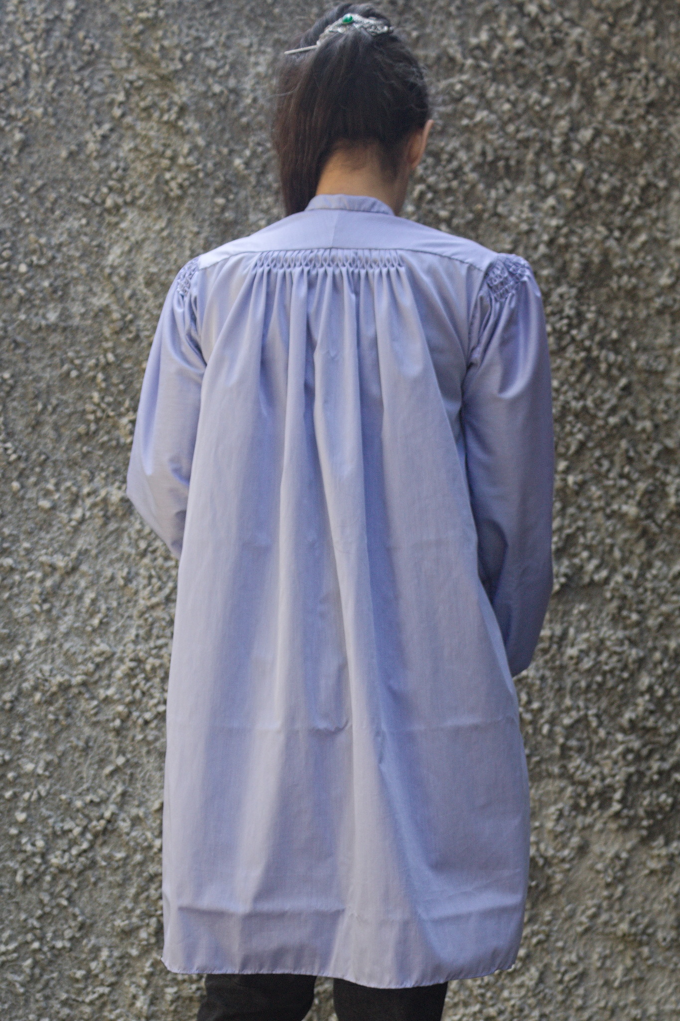 The back of the unbelted shirt: it has a fitted yoke, and then
it is quite wide and unfitted, with the fabric gathered into the
yoke with a row of honeycombing and some pleating on top.
