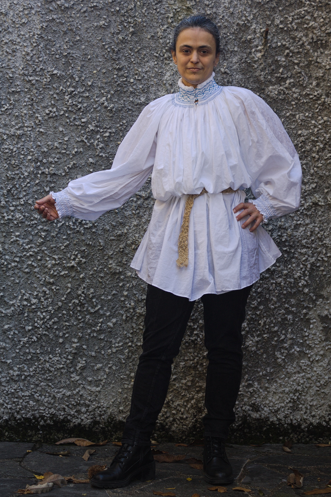 The same shirt belted (which looks nicer); one hand is held out
to show that the cuff is a bit too wide and falls down over the
hand.